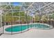 A screened-in pool area featuring a pool, spa, and safety fence at 2856 Broward Ct, Oviedo, FL 32765