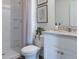This bathroom is equipped with a shower, vanity, framed mirror, and stylish decor at 3017 Moulin Rd, Davenport, FL 33837