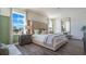This bedroom boasts large windows, a neutral color palette, and wood-look floors at 3017 Moulin Rd, Davenport, FL 33837