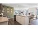 Contemporary kitchen featuring a large island, stainless steel appliances, and an open view of the living area at 3017 Moulin Rd, Davenport, FL 33837