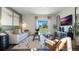 Tastefully decorated living room featuring a plush sofa, stylish coffee table, and a sliding door to the backyard at 3017 Moulin Rd, Davenport, FL 33837