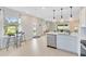 Modern kitchen featuring stainless steel appliances, a center island and view to the backyard at 3199 Emerald Acres Ln, Sanford, FL 32771