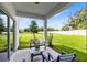 Covered patio featuring outdoor seating and a view of the backyard at 3199 Emerald Acres Ln, Sanford, FL 32771