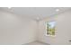 Bright bedroom with large window and recessed lighting at 3742 Se 131St Pl, Belleview, FL 34420