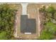 An aerial view of the roof of a single Gathering home highlighting the surrounding lot at 3995 Sw 151 Street, Ocala, FL 34473