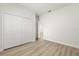 Bedroom with hardwood style floors and large closet at 3995 Sw 151 Street, Ocala, FL 34473