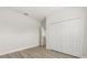 Bedroom with hardwood style floors and large closet at 3995 Sw 151 Street, Ocala, FL 34473