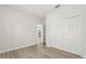 Bedroom with hardwood style floors and large closet at 3995 Sw 151 Street, Ocala, FL 34473