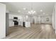 Modern kitchen with stainless appliances, ample white cabinetry, and a stylish center island at 3995 Sw 151 Street, Ocala, FL 34473