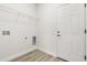 Mud room includes door to outside and a wire rack for storage at 3995 Sw 151 Street, Ocala, FL 34473