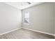 Bedroom with a ceiling fan, wood-look floors and a bright window at 411 Lily Ln, Davenport, FL 33837