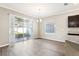 Bright breakfast nook with sliding glass doors leading to a screened lanai at 411 Lily Ln, Davenport, FL 33837
