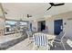 A covered community area with tables and seating near the pool at 411 Lily Ln, Davenport, FL 33837
