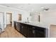 Kitchen view with large island, stainless steel dishwasher, and granite countertops at 411 Lily Ln, Davenport, FL 33837