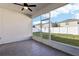 This screened patio looks out into the backyard at 411 Lily Ln, Davenport, FL 33837