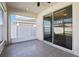 This screened patio has tile floors and a fan at 411 Lily Ln, Davenport, FL 33837