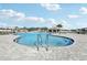 Stunning community pool with zero entry, accessible features, and lounge areas for relaxation and enjoyment at 411 Lily Ln, Davenport, FL 33837