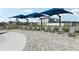 The pool area includes several lounge chairs with sunshades at 411 Lily Ln, Davenport, FL 33837