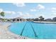 Beautiful community pool with a spacious layout, featuring a covered pavilion and plenty of room for swimming at 411 Lily Ln, Davenport, FL 33837