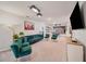 Spacious basement with a plush sofa, chairs, and TV; perfect for game or movie nights at 4149 Lana Ave, Davenport, FL 33897