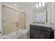 Modern bathroom featuring a glass-enclosed shower and a sleek vanity with granite countertop at 4149 Lana Ave, Davenport, FL 33897