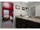 This bathroom offers a double sink vanity with granite countertops at 4149 Lana Ave, Davenport, FL 33897
