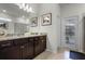 Bathroom featuring double sinks, granite counters, and an outdoor pool view at 4149 Lana Ave, Davenport, FL 33897