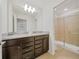 Stylish bathroom with modern lighting, vanity, and glass door shower at 4149 Lana Ave, Davenport, FL 33897
