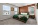 This bedroom features a queen-sized bed, bedside table, and two windows at 4149 Lana Ave, Davenport, FL 33897