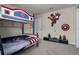 A playful room with bunk beds and Marvel-themed decorations at 4149 Lana Ave, Davenport, FL 33897