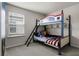 Bright bedroom featuring a themed bunk bed, ladder, and window with horizontal blinds at 4149 Lana Ave, Davenport, FL 33897