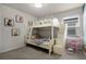Bright room with bunk bed, drawers, ladder and princess themed decor at 4149 Lana Ave, Davenport, FL 33897