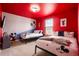 A vibrant room with colorful walls, two twin beds, and playful Mickey Mouse decor at 4149 Lana Ave, Davenport, FL 33897