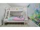 bedroom featuring a whimsical bunk bed with a princess mural accent wall at 4149 Lana Ave, Davenport, FL 33897