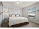 Bedroom with a queen-size bed, an accent wall, and a window for natural light at 4149 Lana Ave, Davenport, FL 33897