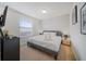 Comfortable bedroom features a plush bed, neutral walls, and soft, cozy carpet at 4149 Lana Ave, Davenport, FL 33897