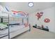 bedroom with a fun bunkbed, Captain America theme and decorations at 4149 Lana Ave, Davenport, FL 33897