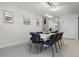 Modern dining room with seating for eight and contemporary chandelier lighting at 4149 Lana Ave, Davenport, FL 33897