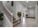 Inviting home entryway with staircase, tile flooring, and decorative accents; plenty of natural light at 4149 Lana Ave, Davenport, FL 33897