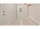 Functional mudroom hallway with built-in storage and neutral tile flooring, combining convenience with clean design at 4149 Lana Ave, Davenport, FL 33897