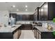 Well-appointed kitchen with stainless steel appliances, granite countertops, and a breakfast bar at 4149 Lana Ave, Davenport, FL 33897