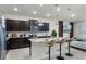 Contemporary kitchen with stainless steel appliances, granite countertops, and seating at the island at 4149 Lana Ave, Davenport, FL 33897