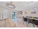Open-concept living area seamlessly connects to dining, offering flexible entertaining space with plentiful natural light at 4149 Lana Ave, Davenport, FL 33897