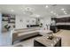 Bright living room featuring modern furnishings, an open floor plan, and a decorative lighting fixture at 4149 Lana Ave, Davenport, FL 33897