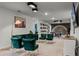 An inviting living room features comfortable green seating and unique decor at 4149 Lana Ave, Davenport, FL 33897