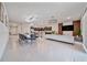 Bright open concept living space featuring modern kitchen, dining area, and stylish furniture, ideal for Gathering gatherings at 4149 Lana Ave, Davenport, FL 33897