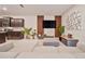 Open-concept living area with a sleek kitchen, stylish furnishings, and contemporary decor, perfect for modern living at 4149 Lana Ave, Davenport, FL 33897