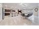 Open-concept kitchen, dining, and living area, featuring modern finishes and abundant natural light, perfect for entertaining at 4149 Lana Ave, Davenport, FL 33897