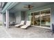 Covered patio with lounge chairs, dining table, and a view of the pool at 4149 Lana Ave, Davenport, FL 33897