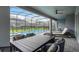 Covered patio featuring outdoor seating and dining area overlooking the pool at 4149 Lana Ave, Davenport, FL 33897